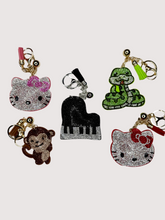 Load image into Gallery viewer, Rhinestone Puffy Keychain - HK, Snake, and Piano

